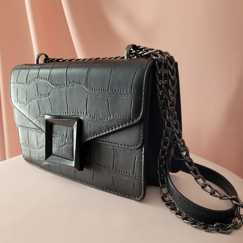 Clutch Your Soul Belle Black croc pattern handbag